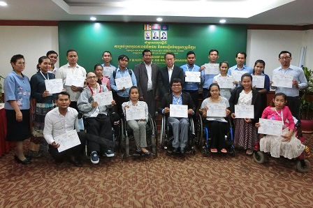 Participants proudly holding up their certificates