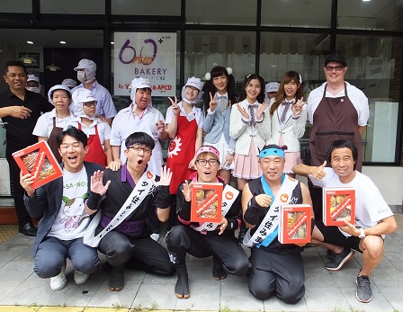 Group photo with Japanese TV hosts and 60+ Plus Bakery & Cafe staff