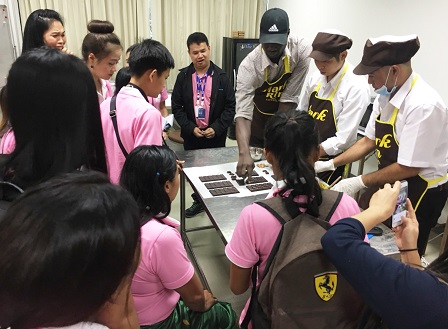 Chocolate-making demonstration by on-the-job trainees with disabilities