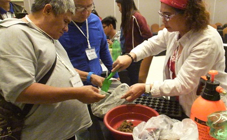 Participants having hands-on training in planting organic vegetables