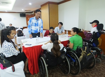 Workshop participants with diverse disabilities during group exercises