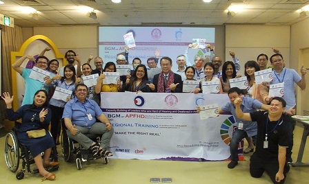 Training participants proudly showing off their certificates after the closing ceremonies
