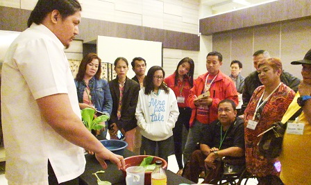All eyes on Mr. Alvarez as he demonstrates the proper washing and preservation of newly-harvested vegetables