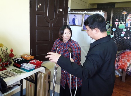 Exchange of information about disability-inclusive business with Ms. Send Awn, owner of a traditional handicraft shop