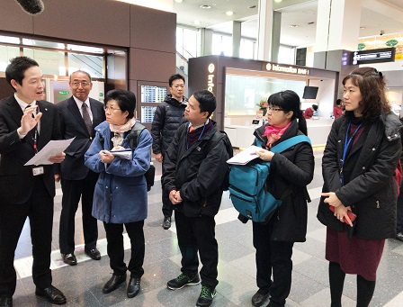 Mr. Watcharapol with project partners observing the use of Mirai speakers at Haneda International Airport
