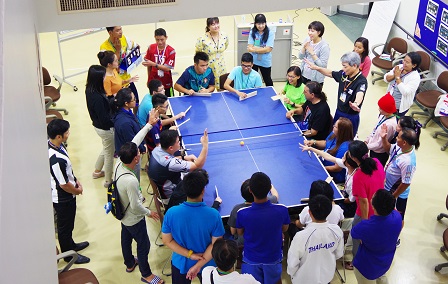 Enjoying a round of Takkyu Volley, a modified inclusive version of table tennis from Japan