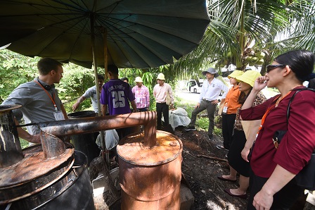 Observing the natural charcoal-making process at Ban Hua Ao Center