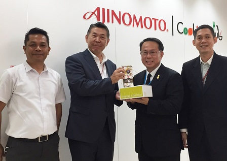 Token of appreciation presented by APCD Executive Director Mr. Piroon Laismit and 60+ Plus Bakery & Chocolate Cafe Manager Mr. Sunthorn Nowarat to Mr. Naoto Minemura (Managing Director, Ajinomoto (Thailand) Co. Ltd.) and Mr. Chaiyapat Ongsri (Director, Ajinomoto Sales (Thailand) Co. Ltd.