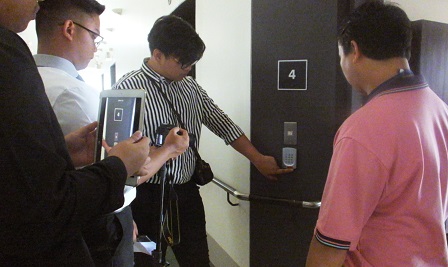 APCD Networking and Collaboration Chief Mr. Watcharapol Chuengcharoen shows visitors elecronic accessibility facilities at the APCD Training Building