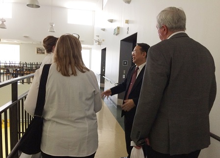 APCD Executive Director Mr. Piroon Laismit giving the visitors a tour of APCD Training Building's accessible facilities