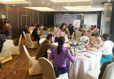 Participants group themselves to discuss the development of policy for persons with autism