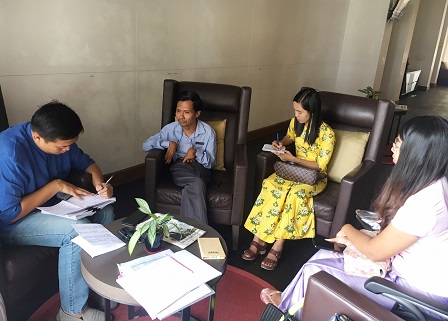 Mr. Myat Thu Win (President, Shwe Minn Tha Foundation). along with colleagues, discuss the project activities and outcomes with a final evaluator