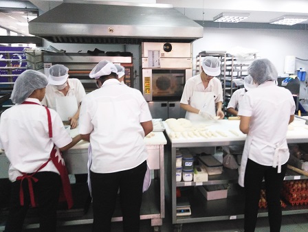 60 Plus+ Bakery & Cafe staff preparing fresh batches of bakery products