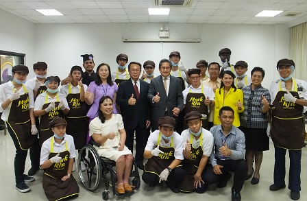 Group photo with 60+ Plus Bakery & Cafe on-the-job trainees with disabilities and APCD management staff