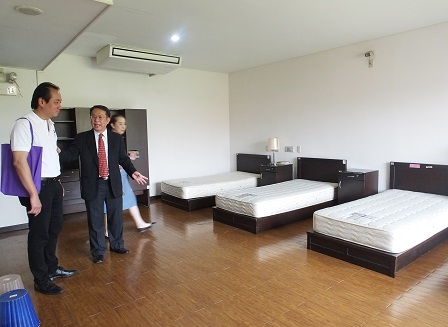 Visitors being shown APCD Training Building's fully accessible accommodation