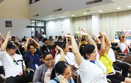 Participants doing the wave during the icebreaker