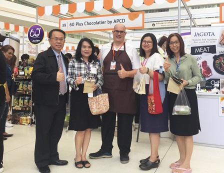 APCD Executive Director Mr. Piroon Laismit and Public Relations Officer Mr. Christopher Benjakul pose with customers