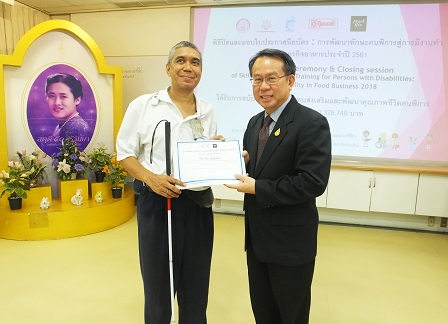 Mr. Piroon presenting certificate to one of the trainees