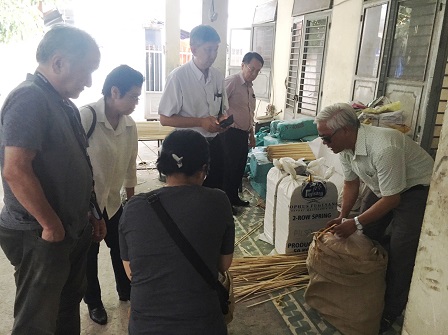 Mr. Linh showing bamboo materials and waste products