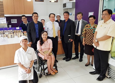 Group photo at the 60+ Plus Bakery and Cafe with staff with diverse disabilities