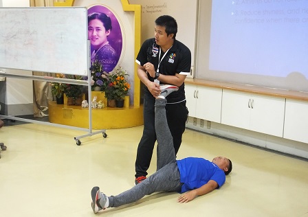 Resource person demonstrating the proper way of stretching