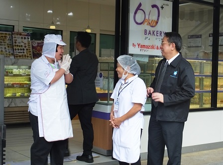 A lighthearted moment with 60 Plus+ Bakery & Cafe staff with disabilities