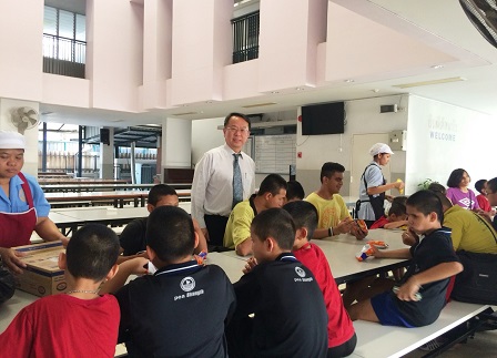 Mr. Piroon with students at dining hall during the students’ recess period
