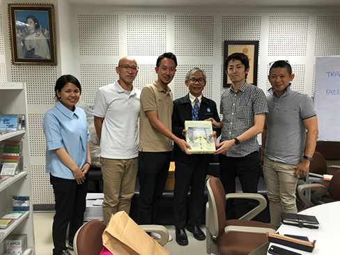Group photo with Japanese Physical and Occupational Therapist, Mr. Somchai Rungsilp, CDD Manager and Mr.Akio Ogura JOCV at APCD