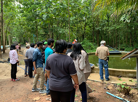  Participants observing the water reservoir made with local resources at Buriram province, Thailand