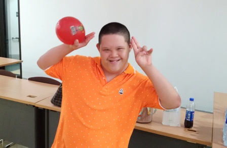 Young self-advocate with intellectual disability taking part in an introduction game