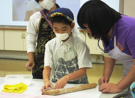   Student learning to make bread