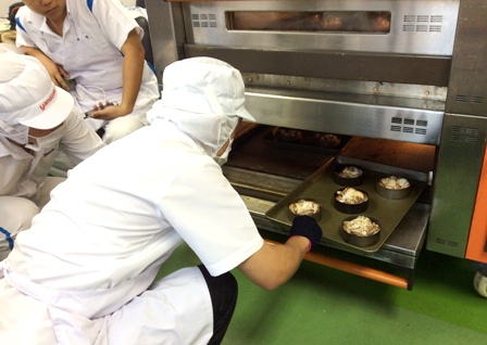 A trainee learning how to bake bread