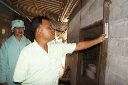 Farm Owner with Disabilities Collecting Eggs