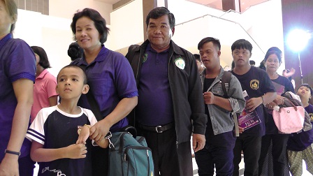Parents with children with autism watching the inclusive drum performance