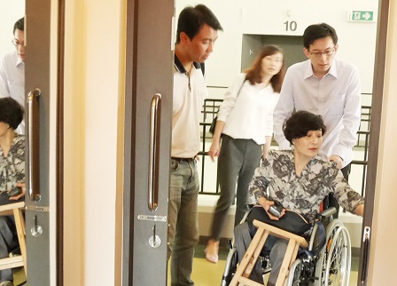 Visitors being shown APCD Training Building's accessible facilities
