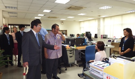 Exchanging greetings with several staff at APCD's Office
