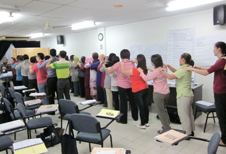 Participants, including APCD staff, taking part in an icebreaker