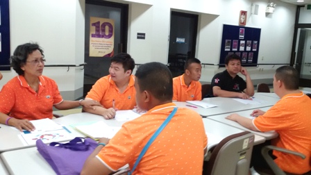 Dao Ruang Group members engaging in a brainstorming session