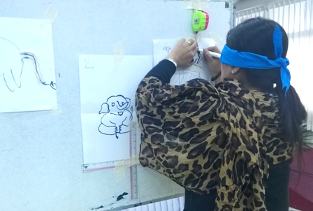Teacher with blindfold doing Workshop exercises