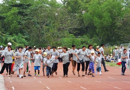 Children with autism and their parents at the track and field event