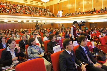 Attentive participants fill the conference venue
