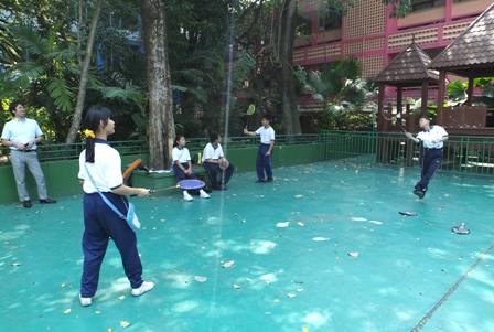 Students playing badminton as an examination