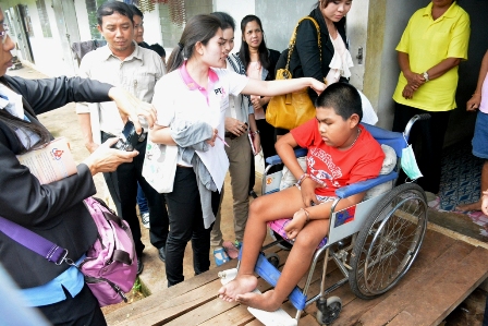 A child wth disability using the makeshift entrance in his home