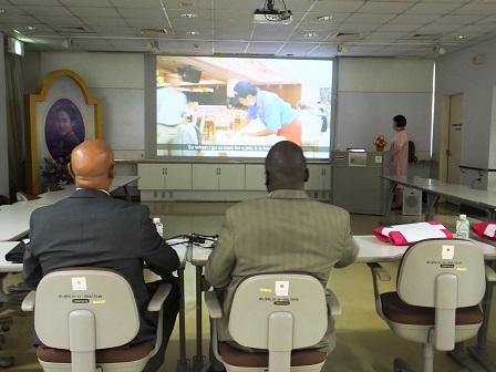 Delegates watching a short video on APCD's 60 Plus+ Bakery & Cafe