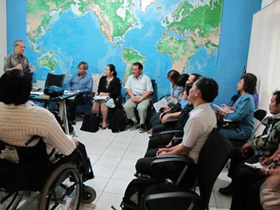 Discussion between CBM Alliance member and APCD mission team